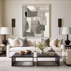 a living room filled with lots of furniture next to a painting on the wall over a coffee table