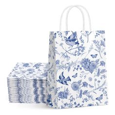 blue and white floral paper bags stacked on top of each other, with one bag in the middle