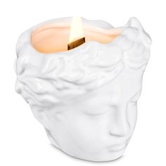 a white candle that is in the shape of a head