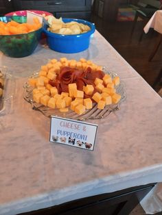 there are many different types of cheeses on the buffet table, including tofu and pumpkin