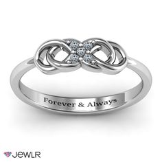 an engagement ring with the words,'embrace here'and two hearts on it