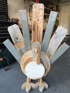 a wooden turkey sitting on top of a table