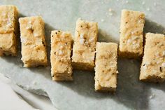 five pieces of food sitting on top of a piece of paper next to each other