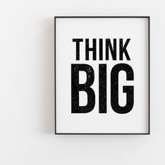 a black and white poster with the words think big on it's front corner