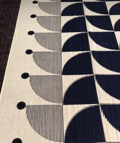 a black and white quilt with circles on it