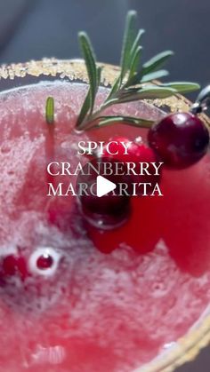 the cranberry margarita is garnished with cherries and rosemary