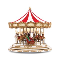 a merry go round ride with horses and people on the front, red and white striped roof