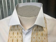 Vintage-never-worn, 1970's, one of a kind men's button up shirt. This dapper 100% cotton, long sleeve shirt is perfect for formal occasions. It is a crisp white shirt with an elegant embroidered star pattern in a gold thread down the center front. It has a formal wing collar, ideal for wearing with a bowtie. The sleeves feature French cuffs which you can pair with your favourite cufflinks. Sz Medium  Made by Phillips of Melbourne Established in 1952, Phillips Shirts is a proud Melbourne based shirtmaker crafting casual shirts in contemporary and vintage inspired prints from premium cloth. Visit my new website   https://phoenixmenswear.com.au/ Lots of fun stuff for guys and girls...!! Please note that if you are ordering from anywhere outside of Australia please add your phone number as it Fitted Embroidered Collared Shirt, Fitted Embroidered Shirt With Spread Collar, Embroidered Fitted Shirt For Formal Occasions, Formal Fitted Embroidered Shirt, Fitted Traditional Collared Shirt, Ls Dress, Wing Collar, Crisp White Shirt, Cotton Long Sleeve Shirt