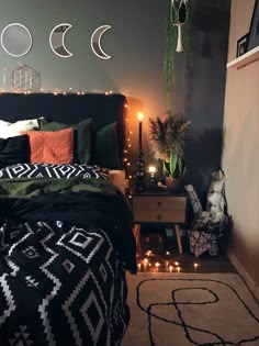 a bed room with a neatly made bed next to a night stand and some lights