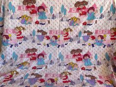 this is an image of children's bedding with princesses on it and pink polka dot bedspread