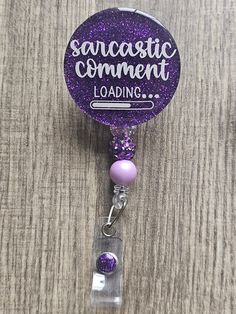 Sarcastic Comment Loading Badge Reel: Fun and Quirky. This witty badge reel features the phrase 'Sarcastic Comment Loading...' with a playful loading bar, perfect for adding a touch of humor to your daily routine. Ideal for healthcare professionals, teachers, or anyone who enjoys a bit of wit, this accessory combines functionality with a touch of humor. Handcrafted with care, this badge reel features a combination of UV resin, glitter, E6000 glue, acrylic, plastic alligator clip reel, and playfu Resin Badge Reel, E6000 Glue, Resin Glitter, Id Badge Reels, Resin Projects, Comic Relief, Turquoise And Purple, Peacock Green, Acrylic Plastic