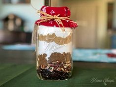 a jar filled with food sitting on top of a table