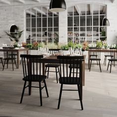 an empty restaurant with wooden tables and chairs