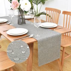 the table is set with plates and silverware, flowers in vases, and napkins