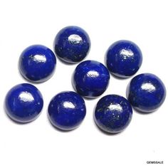 six blue marbles sitting on top of each other