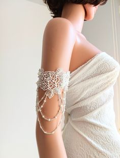 Boho Beach Wedding White Off lace Handmade Arm Cuffs Lace Embellishment with Pearl and Seed Beads.   Hand Beaded   These romantic beach bridal wedding accessory is made from a delicate white-off floral lace and closed with elastic band. You will absolutely love these and they will match your wedding dress perfectly. -It is sold as a pair !! lace lenght : 28 cm ( lace to lace ) , width : 7.5 cm   jewelry lenght include strings : 14 cm  Thanks for checking out my site, and looking at my products. If you have any questions or would like to see more photos please don't hesitate to contact me.  Stored in smoke free area Wedding Dress Arms, Wedding Arms, Beach Wedding Accessories, Beach Wedding White, Yarn Creations, Boho Beach Wedding, Arm Cuffs, Ribbon Jewelry, Arm Jewelry