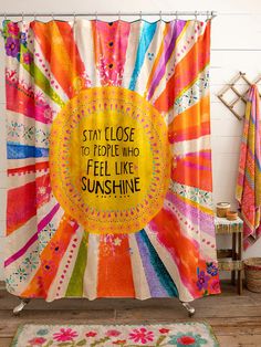 a colorful shower curtain with the words stay close to people who feel like sunshine