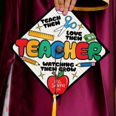 a person wearing a graduation cap with the words teacher written on it