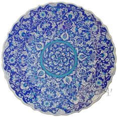 a blue and white plate sitting on top of a table