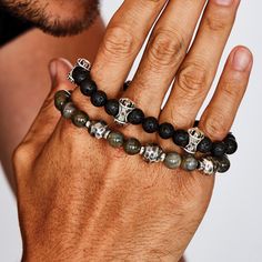 Rugged and porous black lava stone beads and shining sterling silver come together to create the MB CROSS LAVA BEAD Mens Bracelet from King Baby Studio. Cylindrical beads of sterling silver are carved with a classic MB Cross design on each end. Show that your faith shines bright even among the roughest and darkest times with the MB Cross Lava Bead Bracelet for Men. Size: Fits an 8" - 8 1/2" wrist. Beads are 5/16 inch thick or 8mm. One Size Only. Material: 925 Sterling Silver. Black Lava Beads. ( King Baby Jewelry, Mookaite Bracelet, Cool Mens Bracelets, Bead Bracelet For Men, Mens Sterling Silver Bracelets, Mens Bracelet Set, Dad Bracelet, Funky Bracelet, Mens Designer Jewelry