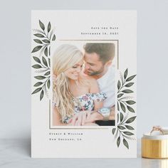 a wedding card with an image of a couple holding each other and the text save the date on it