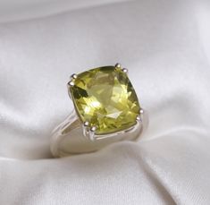 This Ring comes with a 100% Natural Lemon Quartz Gemstone and it is made up of 925 solid sterling silver. This ring is handcrafted by our skilled craftsmen and designed by us. Every gemstone is handpicked for the best quality.  Materials:- Silver (925 Solid Sterling Silver) Gemstone:- Natural Green Gold Quartz Item Weight :- approx. 5 Grams Stone Size :- 12 X 14 MM Stone Weight :- 8 CTS Stone Shape :- Cushion (Cut) Select Size in Variation , if you don't find perfect size please buy any size and Lemon Quartz Ring, Cushion Ring, Set Ring, Lemon Quartz, Quartz Ring, 925 Silver Rings, Rings Statement, Handmade Ring, Green And Gold