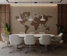 a table with chairs and a large world map on the wall in an office setting