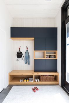 the entryway is clean and ready to be used as a storage area for shoes