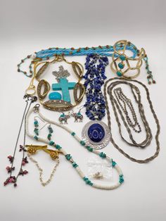 "This is a costume jewelry lot with pieces from the 90's through early 2000's.  Mostly necklaces, a bracelet and a couple pair of earrings. Many southwestern style pieces. Some real gemstones, glass and plastic. One of the silvertone chains is marked \"925\", but it is not silver. Most turquoise looking pieces are faux and not genuine, but there are a couple pieces with real turquoise.  Most pieces are in great condition. Wear to the pieces in this lot varies. There are a couple broken pieces th 2000s Costume, Early 2000s Jewelry, Repurpose Jewelry, 2000s Jewelry, Broken Pieces, Real Turquoise, Jewelry Blue, Southwestern Style, Steel Jewelry