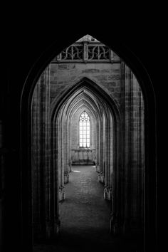 an arched doorway in the middle of a building