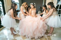 a group of young women standing around each other