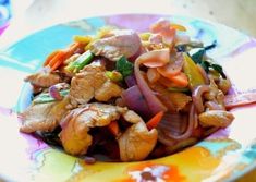 a colorful plate filled with meat and vegetables