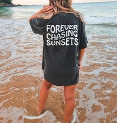 *This design is on the back only* Forever Chasing Sunsets t-shirt. These tees are Comfort Colors and are made to last using premium ringspun cotton, this creates an vintage-soft shirt. The soft-washed, garment-dyed fabric brings extra coziness to your wardrobe while the relaxed fit makes it an excellent daily choice. ✦ 100% Ringspun Cotton ✦ Relaxed fit ✦ Medium fabric ✦ Sewn-in twill label ✦ Eco-friendly, Ethically Made & Sweatshop Free ✦ Printed to order with non-toxic ink ✦ Durable and Long-lasting ✦ Shirts are pre-shrunk but may shrink slightly after washing ✦ Made to order: *Please allow 2-5 business days to print before being shipped* Sizing Recommendation: ✦ See size guide in images above ✦ This is a unisex t-shirt. Order your usual size for a relaxed fit, size down by one if you pr Forever Chasing Sunsets, Washing And Drying Machine, Chasing Sunsets, Photo Care, The Only Exception, Trendy Aesthetic, Shirt Y2k, Coconut Girl, Aesthetic Beach