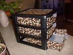 three leopard print boxes stacked on top of each other