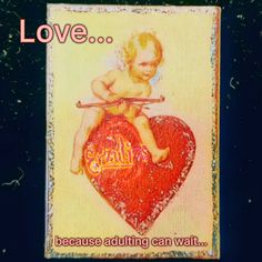 an image of a baby sitting on top of a red heart with words above it