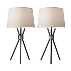 pair of black and gold tripod table lamps with white linen shades on each lamp