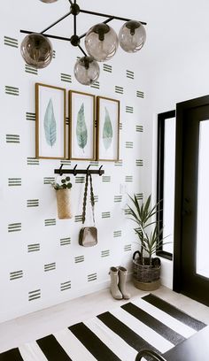 a white room with black and white stripes on the wall