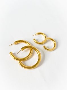 Everyone needs one of these, pairs well with everything and anything. Comes in gold and silver, and in two sizes. Made in Gold Vermeil (18k gold layer on sterling silver) & Sterling Silver Dimensions: small 5mm wide, 22mm inner diameter / large 7mm wide, 45mm inner diameter Everyday Polished Gold Jewelry, Everyday Gold Thick Band Jewelry, Gold Polished Rounded Jewelry, Gold Rounded Jewelry With Polished Finish, Gold Jewelry With Polished Rounded Finish, Gold Jewelry With Polished Finish, Minimalist Gold Jewelry With Shiny Finish, Minimalist Shiny Gold Jewelry, Gift Jewelry With Shiny Finish And Thick Band