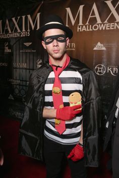 a man dressed up as a mime with a red tie