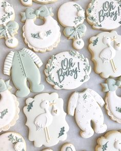 baby shower cookies are arranged on a table