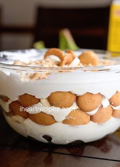 a bowl filled with food sitting on top of a wooden table