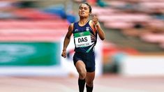 a woman running on a track in a competition