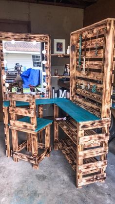 two wooden desks made out of pallet wood with mirrors on the top and bottom