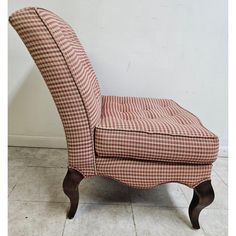 a red and white checkered upholstered chair