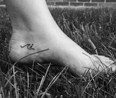 a person with a small tattoo on their foot