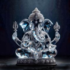 an intricately designed glass ganesha statue