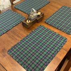 four placemats on top of a wooden table