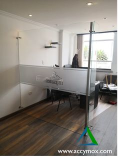 a person sitting at a desk in an office