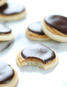 several cookies with chocolate frosting on them