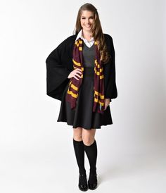 a woman in a harry potter costume posing for the camera with her hands on her hips